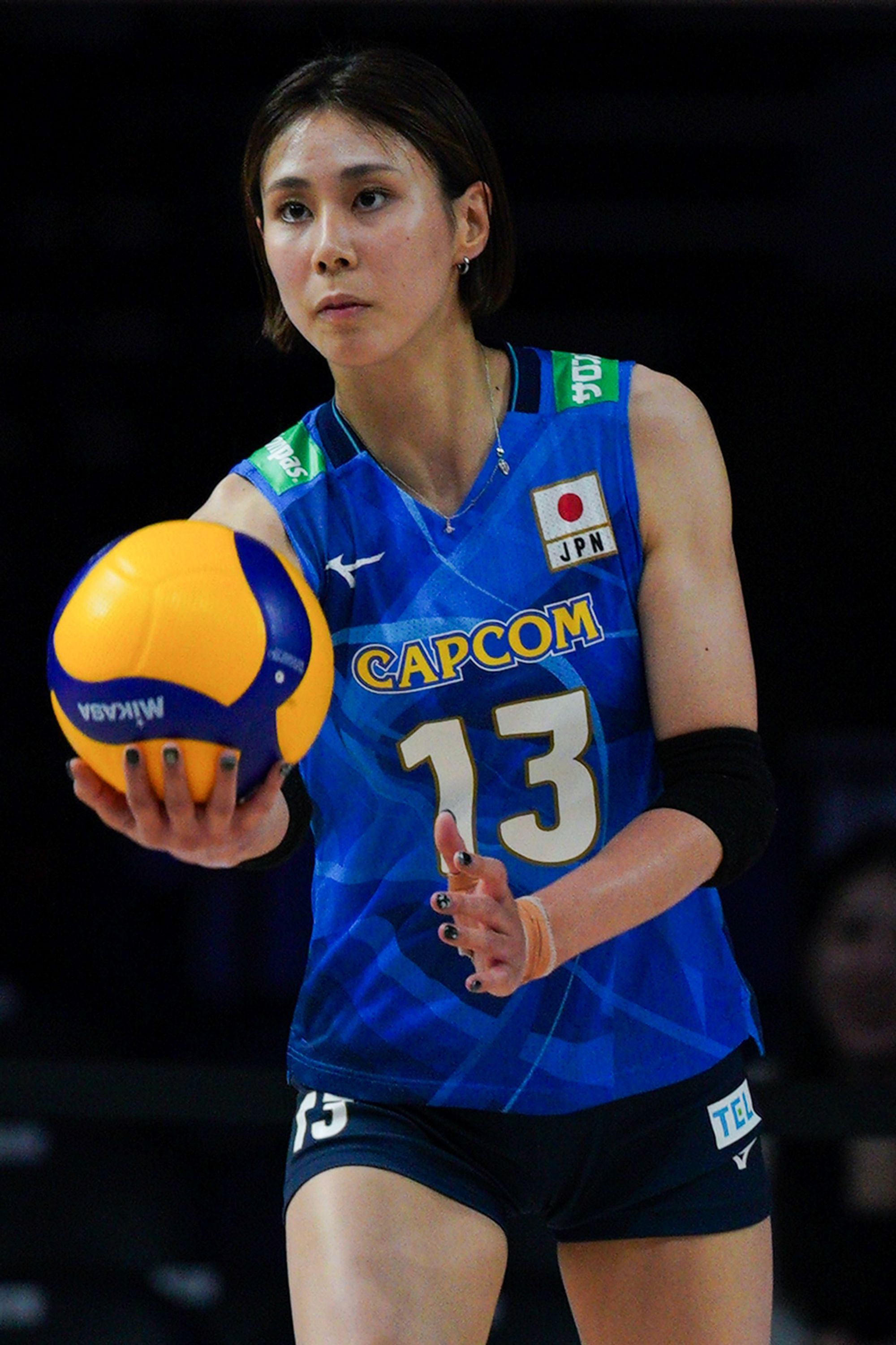 Japan player Yukiko Wada (number 13) jump serve in the game, during Volleyball Nations League between Thailand and Japan.