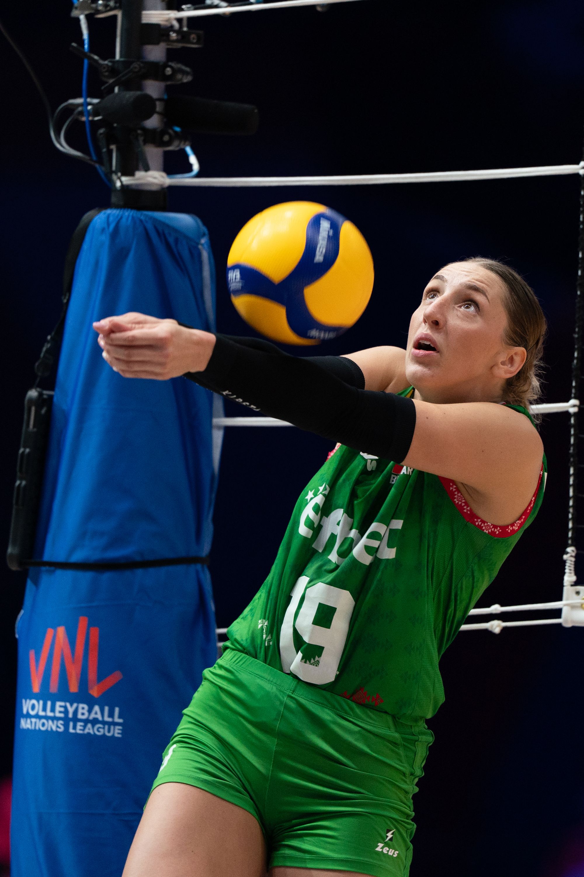 Team Bulgaria player Aleksandra Milanova (number 19) forearm pass the ball.