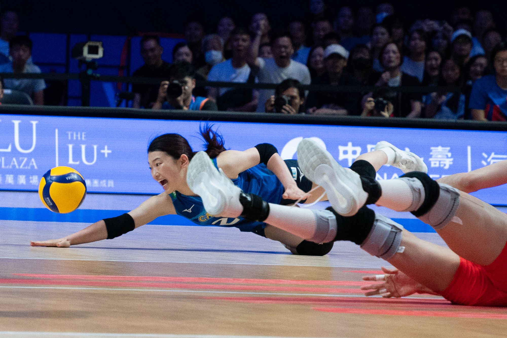 Team Japan player Haruna Kawabata bump pass the ball.