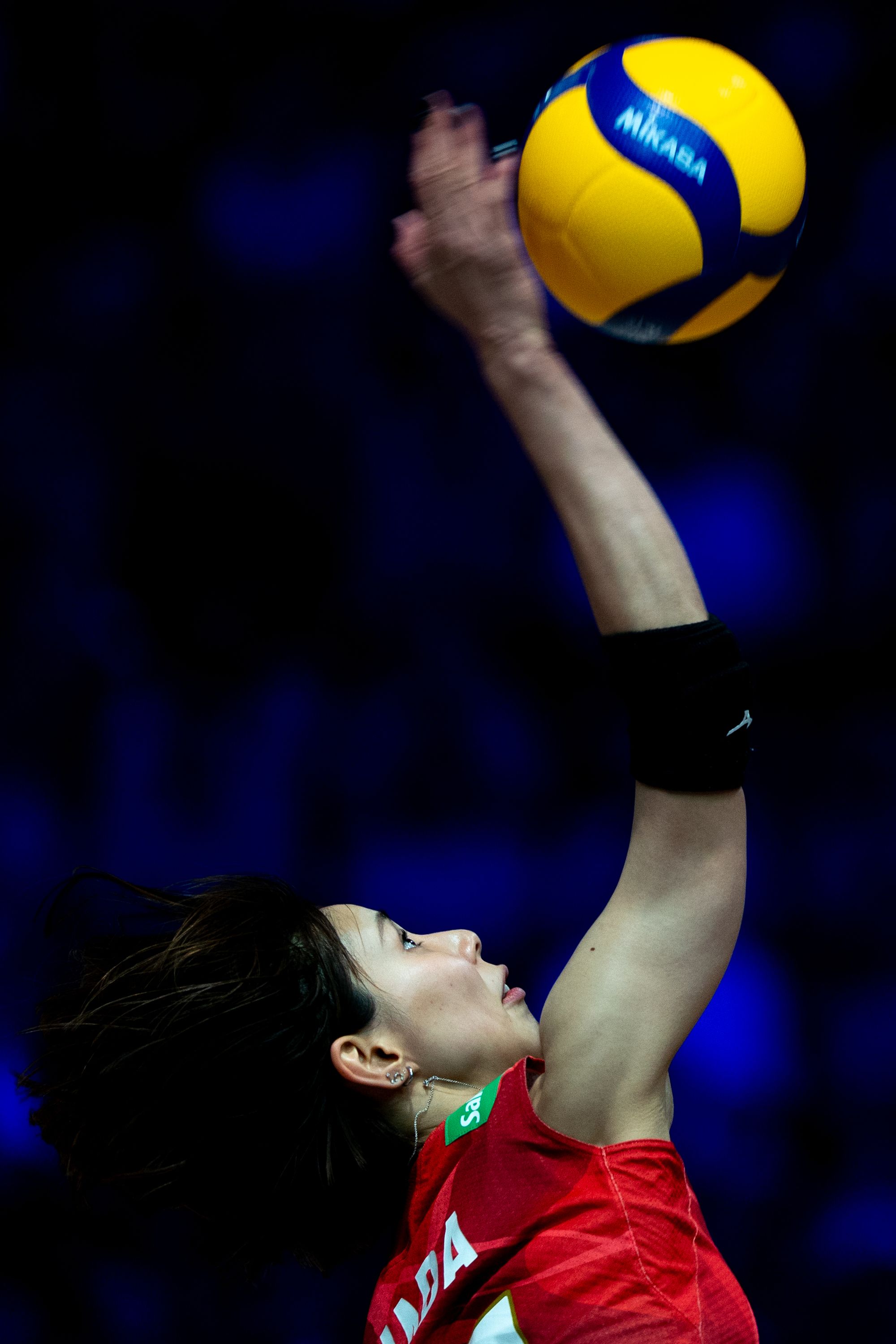 Team Japan player Yukiko Wada (number 13) receive a spike.