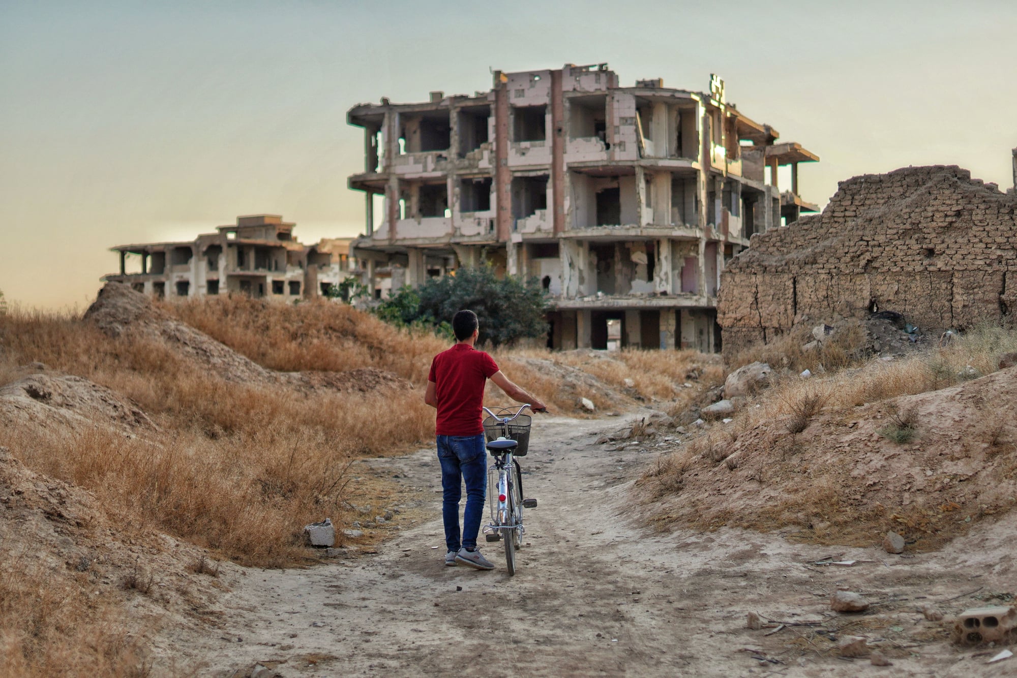 Syrian returns to childhood neighborhood after 15 years.