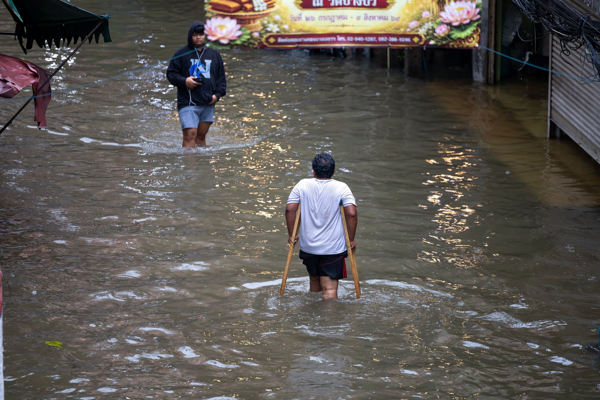Floodwaters affect roads and communities following heavy rainfall in Bangkok and surrounding areas