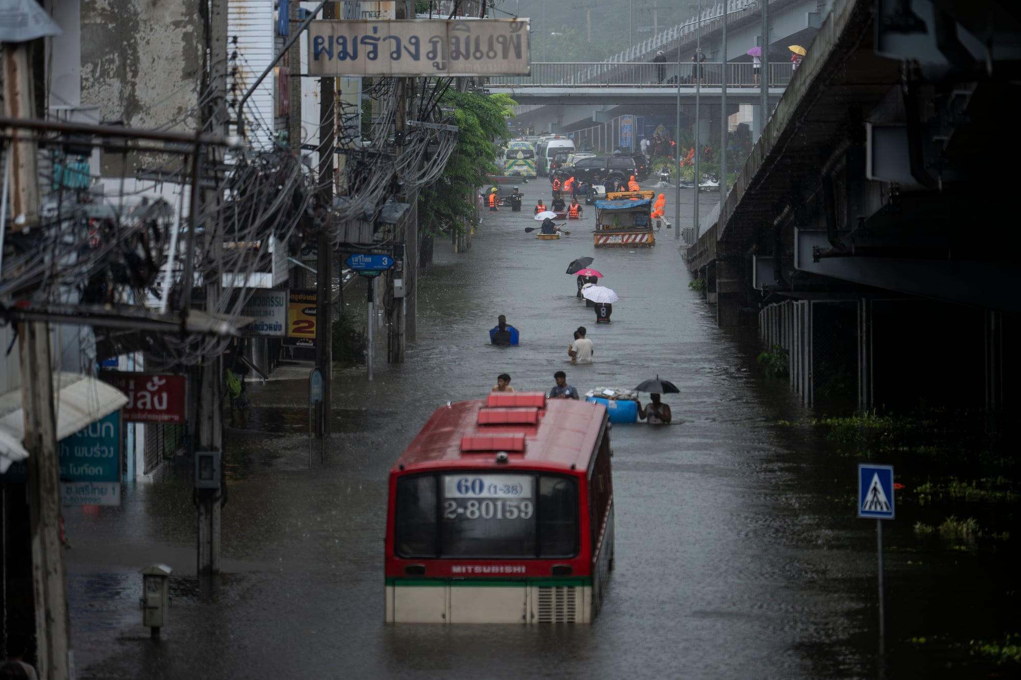 Heavy rains trigger widespread flooding in Bangkok.