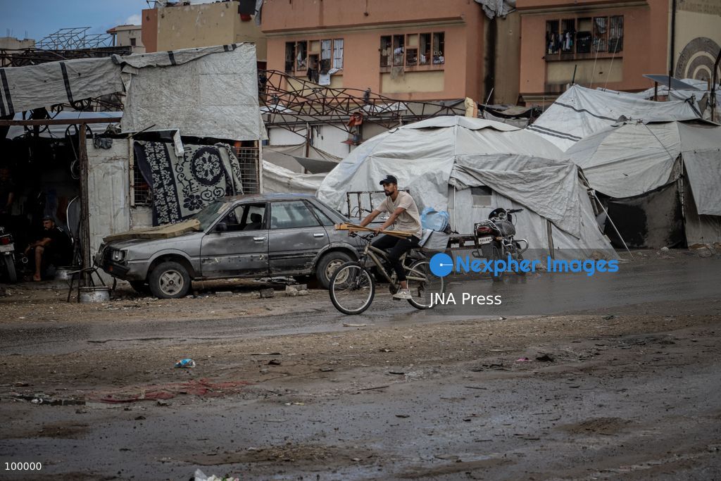 GAZA CITY, GAZA STRIP, OCTOBER 1, 2026: Palestinians go about their daily lives amid rainfall in Gaza City as rain affects streets and residential areas on Thursday evening. Photo by Mohammed M. Skaik / JNA Press. (Photo by Mohammed M Skaik/JNA Press via Nexpher Images)