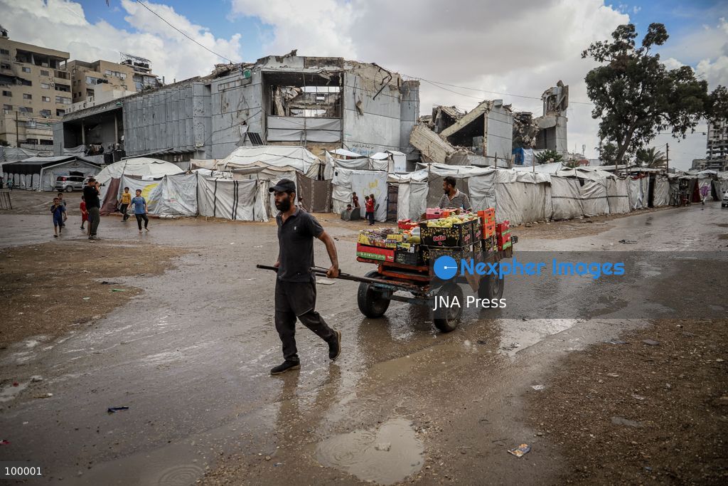 GAZA CITY, GAZA STRIP, OCTOBER 1, 2026: Palestinians go about their daily lives amid rainfall in Gaza City as rain affects streets and residential areas on Thursday evening. Photo by Mohammed M. Skaik / JNA Press. (Photo by Mohammed M Skaik/JNA Press via Nexpher Images)