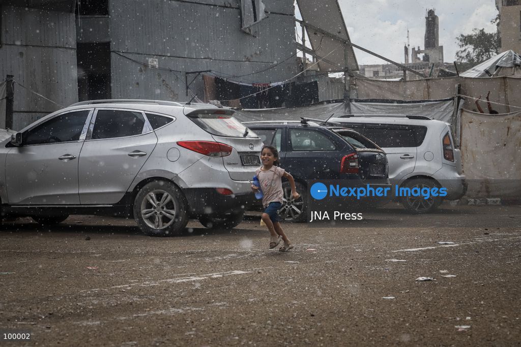 GAZA CITY, GAZA STRIP, OCTOBER 1, 2026: Palestinians go about their daily lives amid rainfall in Gaza City as rain affects streets and residential areas on Thursday evening. Photo by Mohammed M. Skaik / JNA Press. (Photo by Mohammed M Skaik/JNA Press via Nexpher Images)