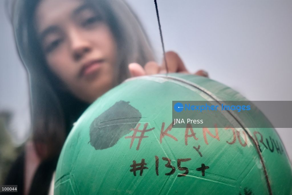 JAKARTA, INDONESIA, OCTOBER 1, 2026: Human rights activists participate in the 927th "Kamisan" (Thursday) protest outside the Merdeka Palace in Jakarta, marking the fourth anniversary of the Kanjuruhan tragedy. The disaster occurred on October 1, 2022, during an Indonesian Liga 1 football match between Arema FC and Persebaya Surabaya at Kanjuruhan Stadium in Malang, East Java. Indonesia's National Commission on Human Rights (Komnas HAM) identified the firing of tear gas by police as the main trigger of the disaster, which resulted in the deaths of 135 people as spectators attempted to escape the stadium. The annual Kamisan protest calls for justice, accountability and the rights of victims and their families. Photo by Edsah Setiawan / JNA Press (Photo by Edsah Setiawan/JNA Press via Nexpher Images)