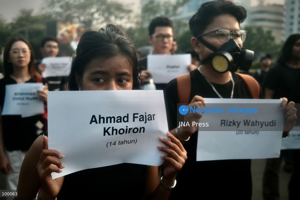 JAKARTA, INDONESIA, OCTOBER 1, 2026: Human rights activists participate in the 927th "Kamisan" (Thursday) protest outside the Merdeka Palace in Jakarta, marking the fourth anniversary of the Kanjuruhan tragedy. The disaster occurred on October 1, 2022, during an Indonesian Liga 1 football match between Arema FC and Persebaya Surabaya at Kanjuruhan Stadium in Malang, East Java. Indonesia's National Commission on Human Rights (Komnas HAM) identified the firing of tear gas by police as the main trigger of the disaster, which resulted in the deaths of 135 people as spectators attempted to escape the stadium. The annual Kamisan protest calls for justice, accountability and the rights of victims and their families. Photo by Edsah Setiawan / JNA Press (Photo by Edsah Setiawan/JNA Press via Nexpher Images)