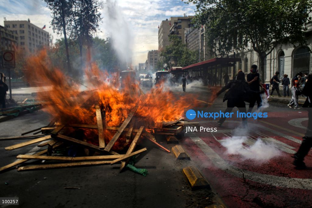 SANTIAGO, CHILE, OCTOBER 1, 2026: Students, workers, teachers and members of social organizations take part in a march in Santiago against the proposed 2027 national budget presented by President Jose Antonio Kast's government. The demonstration, called by the Confederation of Chilean Students (CONFECH) and supported by various social organizations, focused on concerns over public education funding and potential budget cuts to social programs. The proposed budget was submitted to Congress for consideration amid criticism from student groups and unions over the allocation of public resources. Photo by Sebastian Silva / JNA Press. (Photo by Sebastian Silva/JNA Press via Nexpher Images)