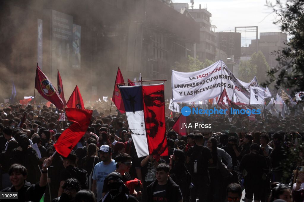 SANTIAGO, CHILE, OCTOBER 1, 2026: Students, workers, teachers and members of social organizations take part in a march in Santiago against the proposed 2027 national budget presented by President Jose Antonio Kast's government. The demonstration, called by the Confederation of Chilean Students (CONFECH) and supported by various social organizations, focused on concerns over public education funding and potential budget cuts to social programs. The proposed budget was submitted to Congress for consideration amid criticism from student groups and unions over the allocation of public resources. Photo by Sebastian Silva / JNA Press. (Photo by Sebastian Silva/JNA Press via Nexpher Images)