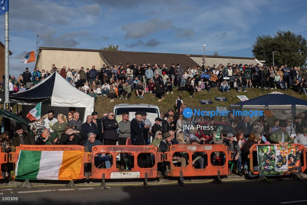PORTADOWN, NORTHERN IRELAND, OCTOBER 1, 2026: Residents of the Garvaghy Road community gather in Portadown amid an ongoing dispute over a proposed Orange Order march through the area. Following several days of talks involving the Orange Order, the Police Service of Northern Ireland (PSNI) and community representatives, residents spend time together with family and friends, with music and chanting. The dispute remained unresolved as negotiations continued over the controversial parade route. Photo by Nadia Caimi / JNA Press. (Photo by Nadia Caimi/JNA Press via Nexpher Images)