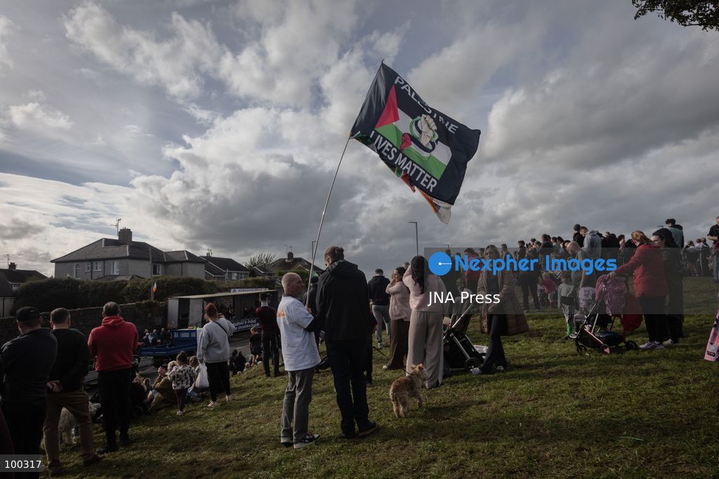 PORTADOWN, NORTHERN IRELAND, OCTOBER 1, 2026: Residents of the Garvaghy Road community gather in Portadown amid an ongoing dispute over a proposed Orange Order march through the area. Following several days of talks involving the Orange Order, the Police Service of Northern Ireland (PSNI) and community representatives, residents spend time together with family and friends, with music and chanting. The dispute remained unresolved as negotiations continued over the controversial parade route. Photo by Nadia Caimi / JNA Press. (Photo by Nadia Caimi/JNA Press via Nexpher Images)