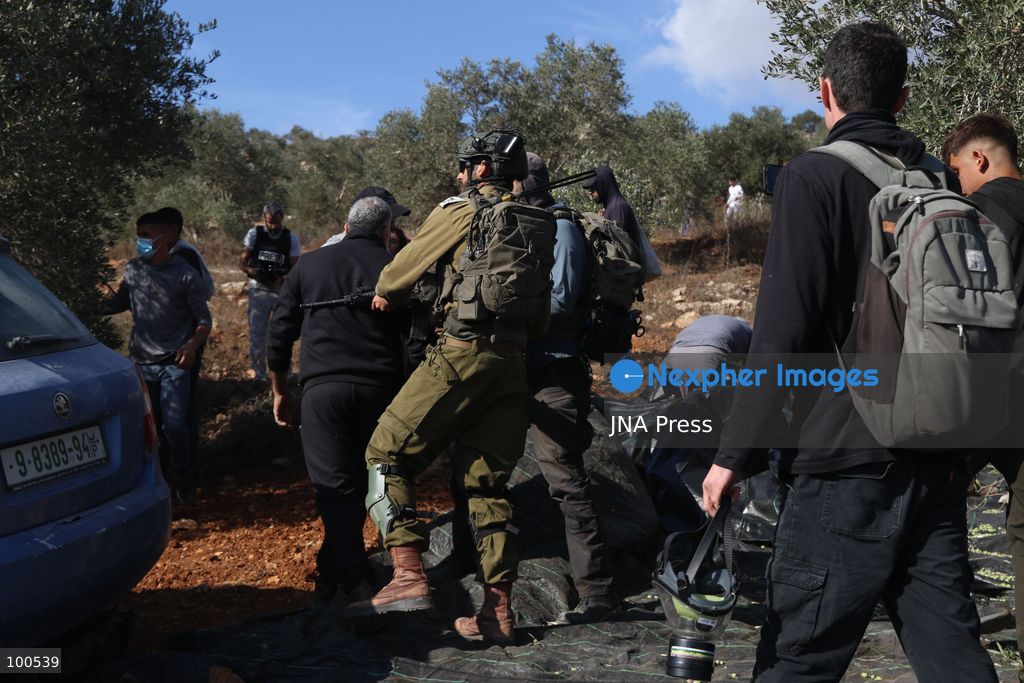 BEITA, NABLUS, PALESTINE – OCTOBER 2, 2026: Israeli settlers and Israeli forces attacked Palestinian farmers while they were picking olives in the Jabal Al-Arma area, east of Beita, south of Nablus. Settlers fired live ammunition toward the farmers, with no injuries reported. According to the Palestinian Red Crescent Society, Israeli forces also beat a 46-year-old Palestinian farmer during raids on olive farms in Beita. Witnesses told Anadolu that Israeli forces fired stun grenades and tear gas at farmers in the Jabal Al-Arma area, forcing them to leave. The olive harvest begins in early October and continues through the end of November, making it an important agricultural and economic season for Palestinian communities. The Palestinian Colonization and Wall Resistance Commission reported that more than 45,000 trees were cut down or damaged across the West Bank during the first half of 2026, including more than 26,000 olive trees. Photo by Salman Mohsen Alkhatib / JNA Press. (Photo by Salman Mohsen Alkhatib/JNA Press via Nexpher Images)