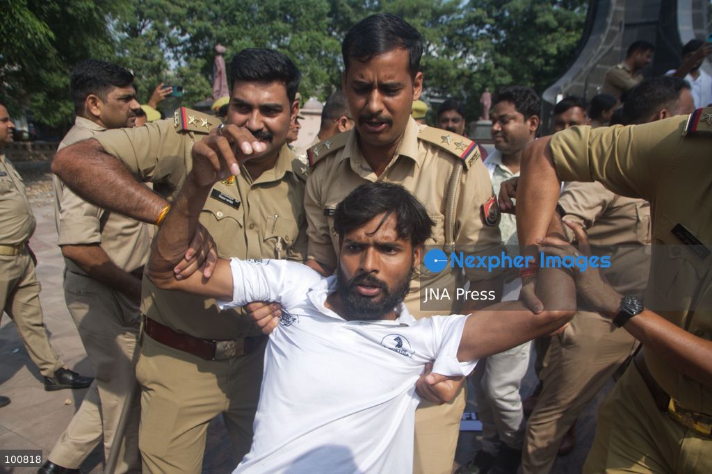 LUCKNOW, INDIA, OCTOBER 2, 2026: Police detain members of the Students' Federation of India and other activists during a protest at Parivartan Chowk in Lucknow against Chief Election Commissioner Gyanesh Kumar. Demonstrators demanded Kumar's resignation and raised concerns over the Election Commission's Special Intensive Revision of electoral rolls. Police stopped protesters as they attempted to march through the city, detaining students and activists. The Election Commission has defended the voter-roll revision process and rejected allegations of wrongdoing. Photo by Amit Shukla / JNA Press. (Photo by Amit shukla/JNA Press via Nexpher Images)