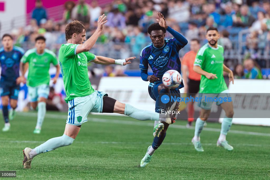 Stuart Hawkins #39 of Seattle Sounders FC and Stephen Afrifa #17 of Sporting Kansas City battle for the ball during the MLS match between Sounders FC and Sporting Kansas City at Lumen Field. on October 1, 2026 in Seattle, Washington. (Photo by Jules Doyle/ Eyepix Group) (Photo by Jules Doyle/ Eyepix Group/Eyepix via Nexpher Images)