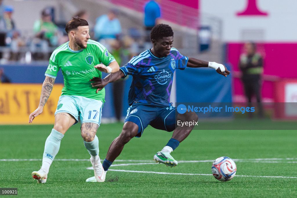 Kwaku Agyabeng #20 of Sporting Kansas City and Paul Arriola #17 of Seattle Sounders FC battle for the ball during the MLS match between Sounders FC and Sporting Kansas City at Lumen Field. on October 1, 2026 in Seattle, Washington. (Photo by Jules Doyle/ Eyepix Group) (Photo by Jules Doyle/ Eyepix Group/Eyepix via Nexpher Images)