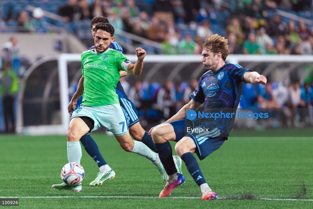 Cristian Roldan #7 of Seattle Sounders FC and Wyatt Meyer #28 of Sporting Kansas City battle for the ball during the MLS match between Sounders FC and Sporting Kansas City at Lumen Field. on October 1, 2026 in Seattle, Washington. (Photo by Jules Doyle/ Eyepix Group) (Photo by Jules Doyle/ Eyepix Group/Eyepix via Nexpher Images)