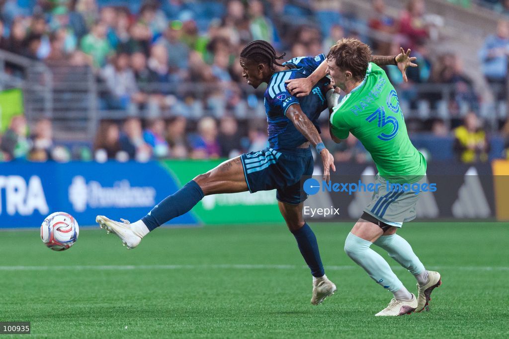 André Luiz #11 of Sporting Kansas City is pressured by Stuart Hawkins #39 of Seattle Sounders FC during the MLS match between Sounders FC and Sporting Kansas City at Lumen Field. on October 1, 2026 in Seattle, Washington. (Photo by Jules Doyle/ Eyepix Group) (Photo by Jules Doyle/ Eyepix Group/Eyepix via Nexpher Images)