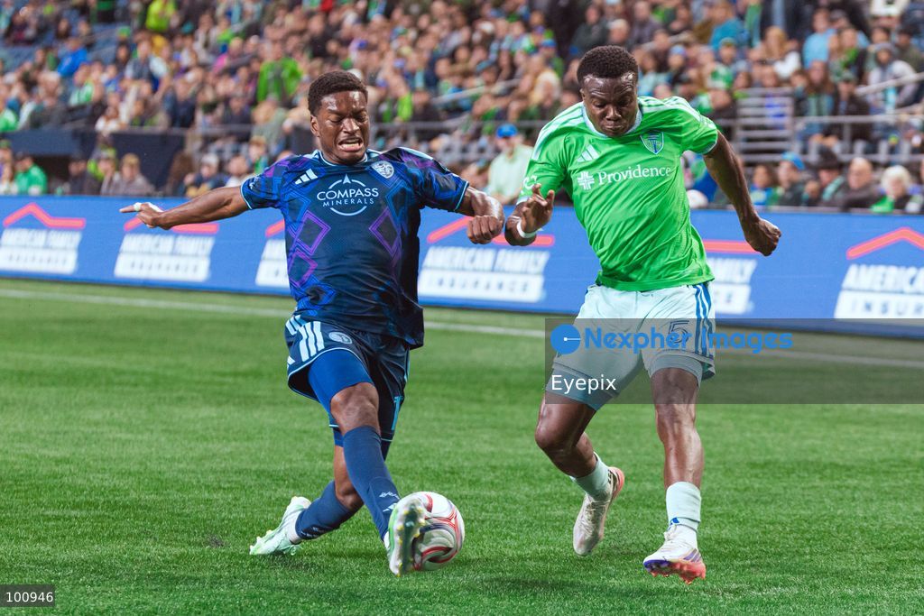 Nouhou Tolo #5 of Seattle Sounders FC and Justin Reynolds #13 of Sporting Kansas City battle for the ball during the MLS match between Sounders FC and Sporting Kansas City at Lumen Field. on October 1, 2026 in Seattle, Washington. (Photo by Jules Doyle/ Eyepix Group) (Photo by Jules Doyle/ Eyepix Group/Eyepix via Nexpher Images)