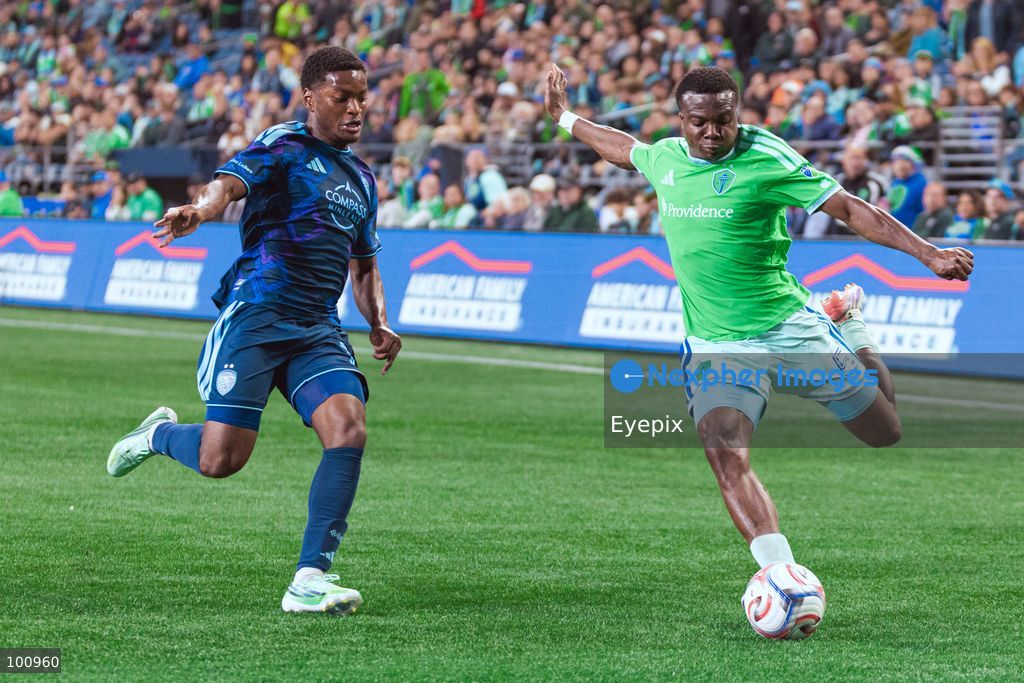 Nouhou Tolo #5 of Seattle Sounders FC is pressured by Justin Reynolds #13 of Sporting Kansas City during the MLS match between Sounders FC and Sporting Kansas City at Lumen Field. on October 1, 2026 in Seattle, Washington. (Photo by Jules Doyle/ Eyepix Group) (Photo by Jules Doyle/ Eyepix Group/Eyepix via Nexpher Images)
