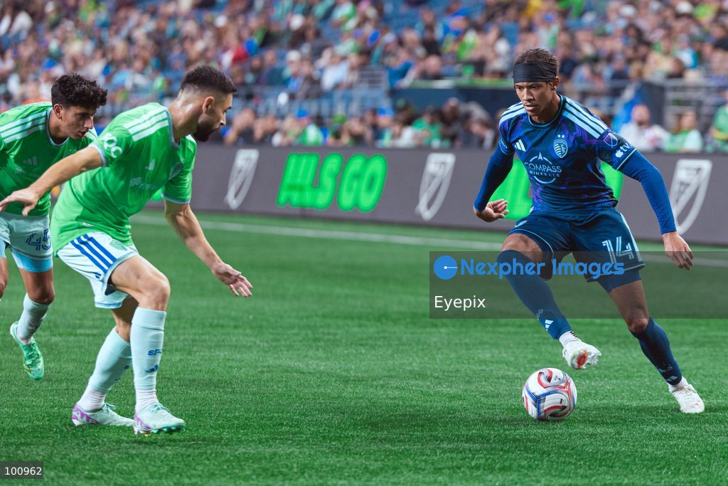 Calvin Harris #14 of Sporting Kansas City dribbles the ball during the MLS match between Sounders FC and Sporting Kansas City at Lumen Field. on October 1, 2026 in Seattle, Washington. (Photo by Jules Doyle/ Eyepix Group) (Photo by Jules Doyle/ Eyepix Group/Eyepix via Nexpher Images)