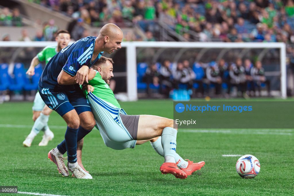 Jordan Morris #13 of Seattle Sounders FC and Jansen Miller #15 of Sporting Kansas City battle for the ball during the MLS match between Sounders FC and Sporting Kansas City at Lumen Field. on October 1, 2026 in Seattle, Washington. (Photo by Jules Doyle/ Eyepix Group) (Photo by Jules Doyle/ Eyepix Group/Eyepix via Nexpher Images)