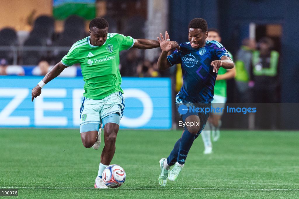 Nouhou Tolo #5 of Seattle Sounders FC and Justin Reynolds #13 of Sporting Kansas City battle for the ball during the MLS match between Sounders FC and Sporting Kansas City at Lumen Field. on October 1, 2026 in Seattle, Washington. (Photo by Jules Doyle/ Eyepix Group) (Photo by Jules Doyle/ Eyepix Group/Eyepix via Nexpher Images)