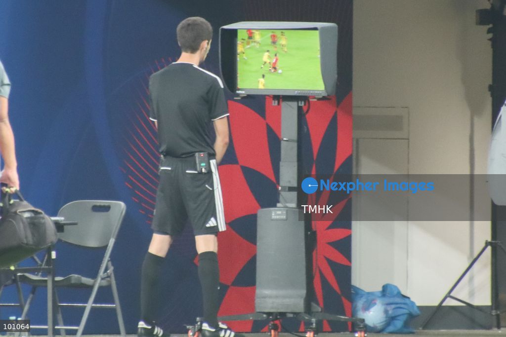 The match referee inspects the pitchside Video Assistant Referee (VAR) monitor to review a challenge by Brunei defender Mohd Hanif bin Hamir on Hong Kong, China forward Matt Orr during the second half of their FIFA ASEAN Cup Tier 2 encounter at Kai Tak Stadium on September 30, 2026 in Hong Kong. (Photo by Gordon Choi/TMHK via Nexpher Images)