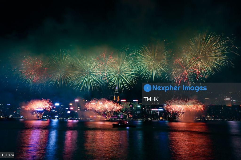 A general view captured from the viewing deck outside the Hong Kong Cultural Centre in Tsim Sha Tsui shows fireworks exploding in vibrant colours above Victoria Harbour against the backdrop of illuminated skyscrapers along the Hong Kong Island skyline during the 77th National Day celebrations on October 1, 2026 in Hong Kong. (Photo by Gordon Choi/TMHK via Nexpher Images)