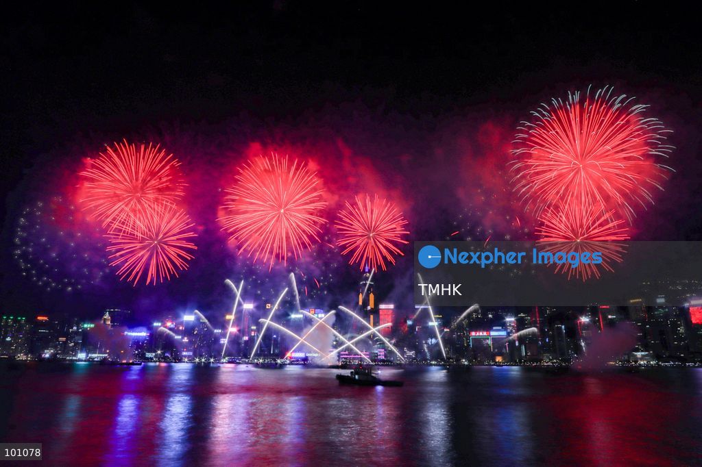 A general view captured from the viewing deck outside the Hong Kong Cultural Centre in Tsim Sha Tsui shows fireworks exploding in vibrant colours above Victoria Harbour against the backdrop of illuminated skyscrapers along the Hong Kong Island skyline during the 77th National Day celebrations on October 1, 2026 in Hong Kong. (Photo by Gordon Choi/TMHK via Nexpher Images)