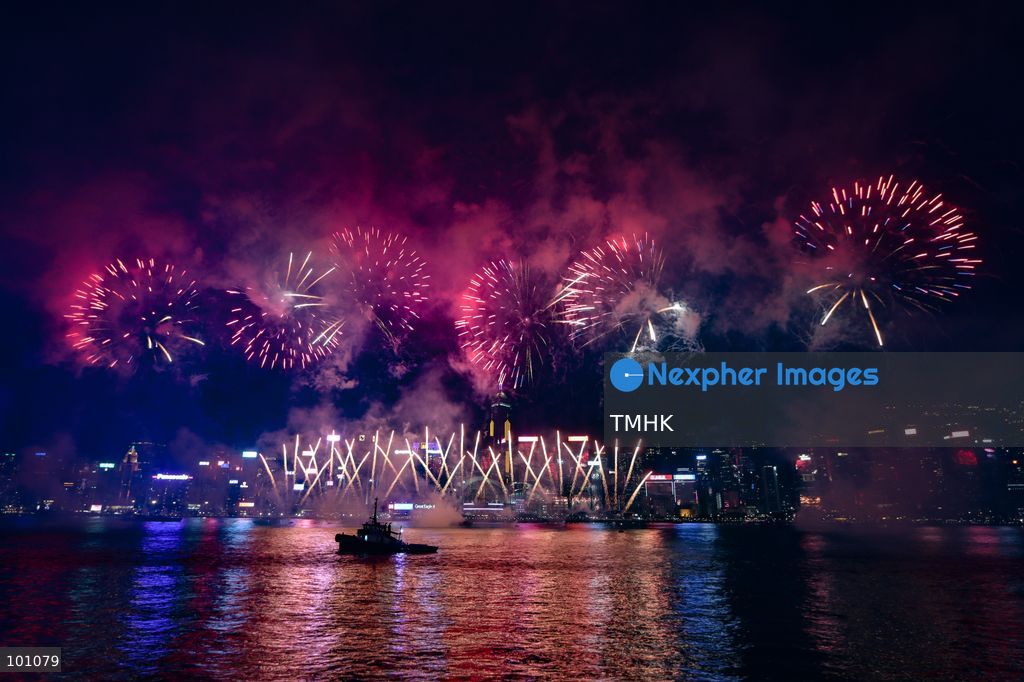 A general view captured from the viewing deck outside the Hong Kong Cultural Centre in Tsim Sha Tsui shows fireworks exploding in vibrant colours above Victoria Harbour against the backdrop of illuminated skyscrapers along the Hong Kong Island skyline during the 77th National Day celebrations on October 1, 2026 in Hong Kong. (Photo by Gordon Choi/TMHK via Nexpher Images)