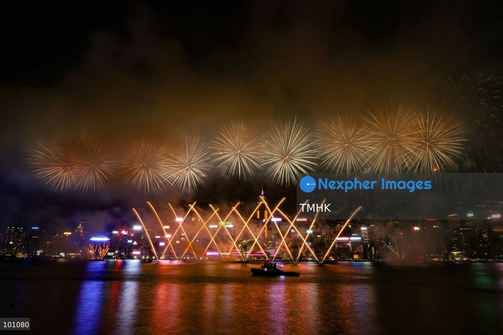 A general view captured from the viewing deck outside the Hong Kong Cultural Centre in Tsim Sha Tsui shows fireworks exploding in vibrant colours above Victoria Harbour against the backdrop of illuminated skyscrapers along the Hong Kong Island skyline during the 77th National Day celebrations on October 1, 2026 in Hong Kong. (Photo by Gordon Choi/TMHK via Nexpher Images)