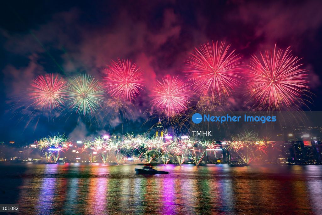 A general view captured from the viewing deck outside the Hong Kong Cultural Centre in Tsim Sha Tsui shows fireworks exploding in vibrant colours above Victoria Harbour against the backdrop of illuminated skyscrapers along the Hong Kong Island skyline during the 77th National Day celebrations on October 1, 2026 in Hong Kong. (Photo by Gordon Choi/TMHK via Nexpher Images)