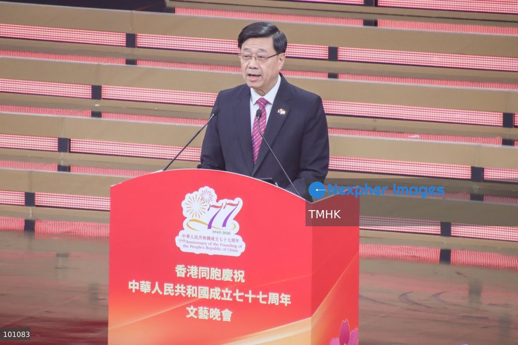 A close-up headshot captures Hong Kong Chief Executive John Lee Ka-chiu addressing the audience during the variety show celebrating the 77th anniversary of the founding of the People's Republic of China at the Hong Kong Coliseum in Hung Hom on October 2, 2026 in Hong Kong. Lee stressed that the HKSAR's first Five-Year Plan will proactively align with the national 15th Five-Year Plan to seize emerging development opportunities. (Photo by Gordon Choi/TMHK via Nexpher Images)