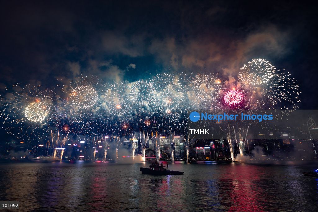 A general view captured from the viewing deck outside the Hong Kong Cultural Centre in Tsim Sha Tsui shows fireworks exploding in vibrant colours above Victoria Harbour against the backdrop of illuminated skyscrapers along the Hong Kong Island skyline during the 77th National Day celebrations on October 1, 2026 in Hong Kong. (Photo by Gordon Choi/TMHK via Nexpher Images)