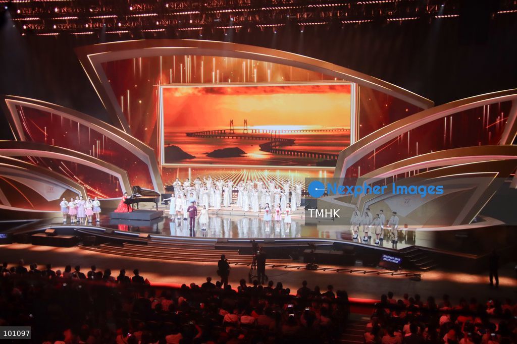 A general view shows artistes performing on stage under dramatic illumination during the variety show celebrating the 77th anniversary of the founding of the People's Republic of China before more than 5,000 spectators at the Hong Kong Coliseum in Hung Hom on October 2, 2026 in Hong Kong. (Photo by Gordon Choi/TMHK via Nexpher Images)