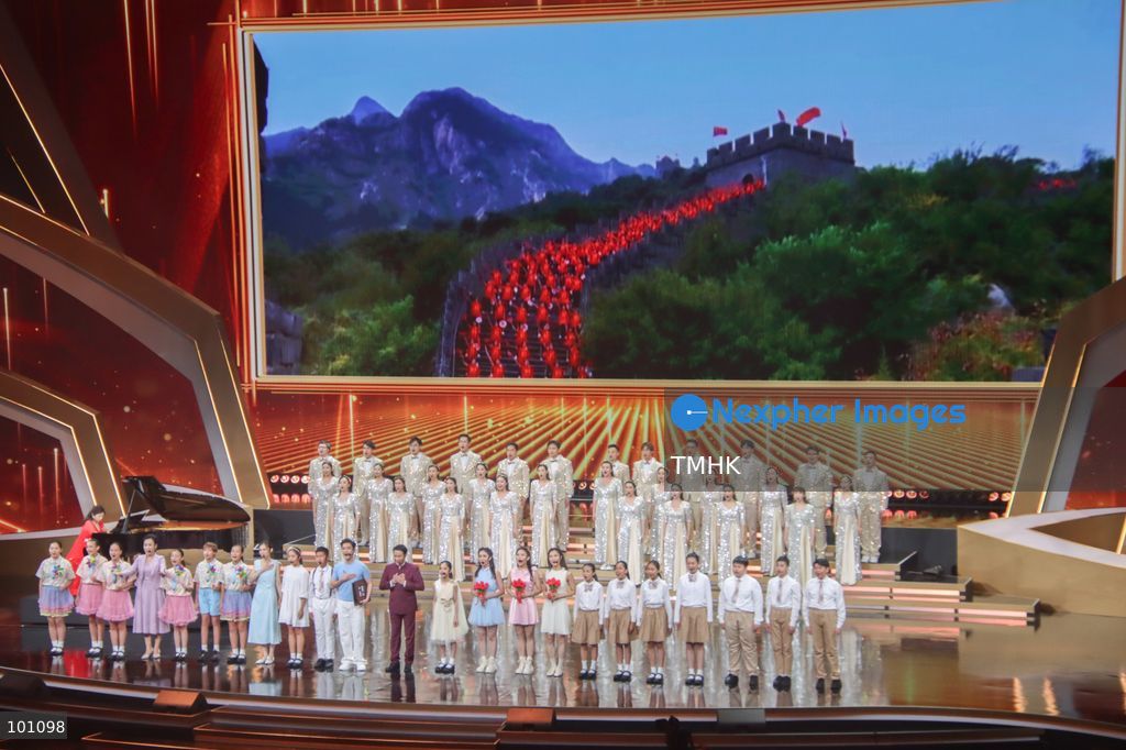 A general view shows artistes performing on stage under dramatic illumination during the variety show celebrating the 77th anniversary of the founding of the People's Republic of China before more than 5,000 spectators at the Hong Kong Coliseum in Hung Hom on October 2, 2026 in Hong Kong. (Photo by Gordon Choi/TMHK via Nexpher Images)