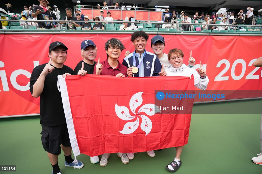Hong Kong Tennis player, Coleman Wong Chak-lam and the YouTube channel JFFT members holding Hong Kong flag, Coleman wins the Men's Final at the 2026 Asian games on October 3, 2026 in Nagoya, Japan. (Photo by Ellan Mad/Nexpher Images)