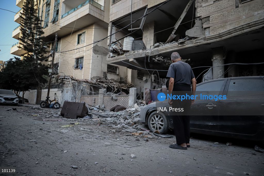 GAZA CITY, GAZA STRIP, OCTOBER 3, 2026: Palestinians and rescue workers search through the rubble following an Israeli airstrike on a residential building in the Rimal neighborhood of western Gaza City early Saturday. At least five Palestinians were killed and others wounded in the strike, according to Gaza health and civil defense officials. Rescue crews continued searching the damaged building for missing people following the attack. There was no immediate comment from the Israeli military. Photo by Mohammed M. Skaik / JNA Press (Photo by Mohammed M Skaik/JNA Press via Nexpher Images)