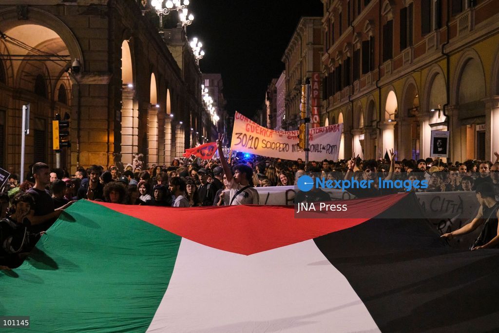 BOLOGNA, ITALY, OCTOBER 2, 2026: Hundreds of demonstrators march through Bologna during a protest against what organizers describe as state and police violence, one year after clashes during a pro-Palestinian demonstration on Viale Masini. Lince, an activist who suffered permanent damage to one eye after being struck by a tear gas canister during the October 2, 2025 demonstration, addressed participants before the march proceeded toward the site where she was injured. The demonstration was organized by the Lince campaign and Giovani Palestinesi. Photo by Lorenzo Paini / JNA Press. (Photo by Lorenzo Pasini/JNA Press via Nexpher Images)