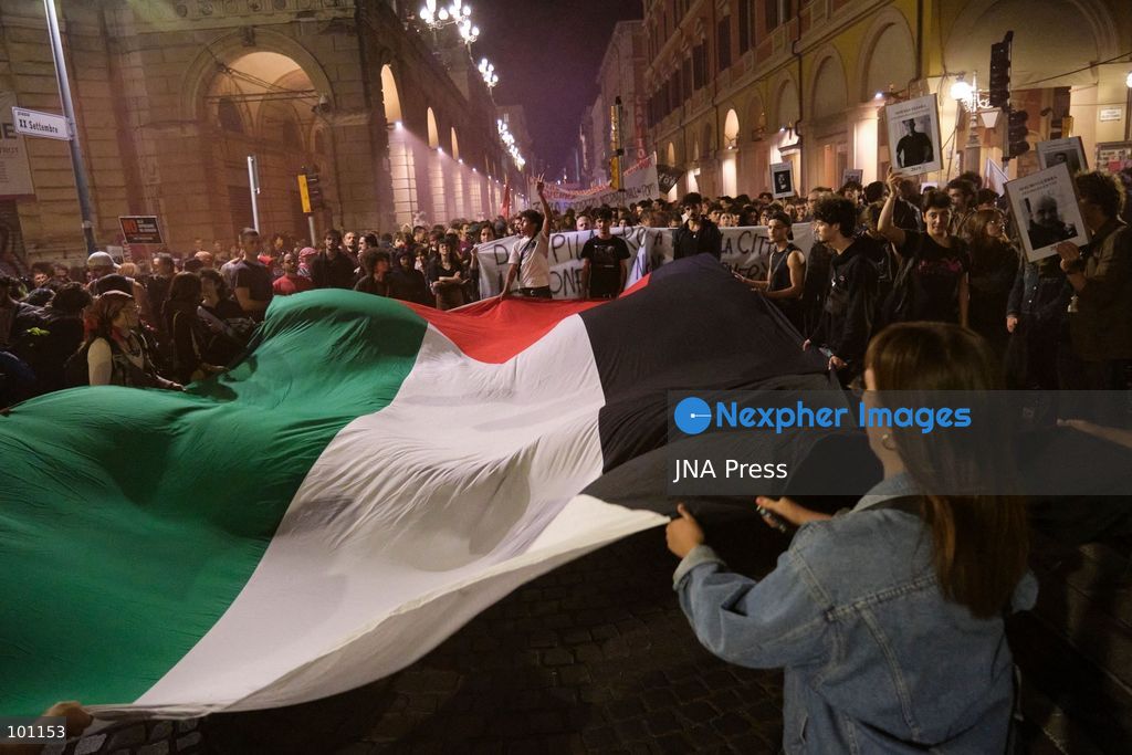 BOLOGNA, ITALY, OCTOBER 2, 2026: Hundreds of demonstrators march through Bologna during a protest against what organizers describe as state and police violence, one year after clashes during a pro-Palestinian demonstration on Viale Masini. Lince, an activist who suffered permanent damage to one eye after being struck by a tear gas canister during the October 2, 2025 demonstration, addressed participants before the march proceeded toward the site where she was injured. The demonstration was organized by the Lince campaign and Giovani Palestinesi. Photo by Lorenzo Paini / JNA Press. (Photo by Lorenzo Pasini/JNA Press via Nexpher Images)
