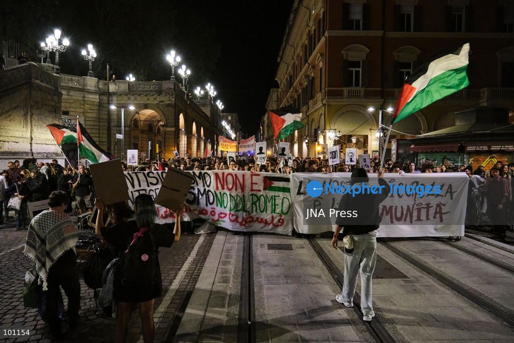 BOLOGNA, ITALY, OCTOBER 2, 2026: Hundreds of demonstrators march through Bologna during a protest against what organizers describe as state and police violence, one year after clashes during a pro-Palestinian demonstration on Viale Masini. Lince, an activist who suffered permanent damage to one eye after being struck by a tear gas canister during the October 2, 2025 demonstration, addressed participants before the march proceeded toward the site where she was injured. The demonstration was organized by the Lince campaign and Giovani Palestinesi. Photo by Lorenzo Paini / JNA Press. (Photo by Lorenzo Pasini/JNA Press via Nexpher Images)