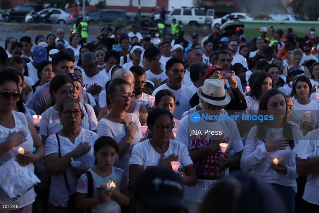 LA GUAIRA, VENEZUELA, OCTOBER 2, 2026: Families of victims, survivors and rescue workers gather during the "Haz de Luz" vigil in La Guaira to commemorate 100 days since the devastating earthquakes of June 24. Participants lit candles and joined prayers in memory of those killed and missing, while beams of light were projected into the sky near areas heavily damaged by the disaster. The commemorative event brought together residents, volunteers and emergency workers as recovery and search efforts continue in parts of La Guaira. Photo by Mario Flores/ JNA Press. (Photo by Mario Flores/JNA Press via Nexpher Images)