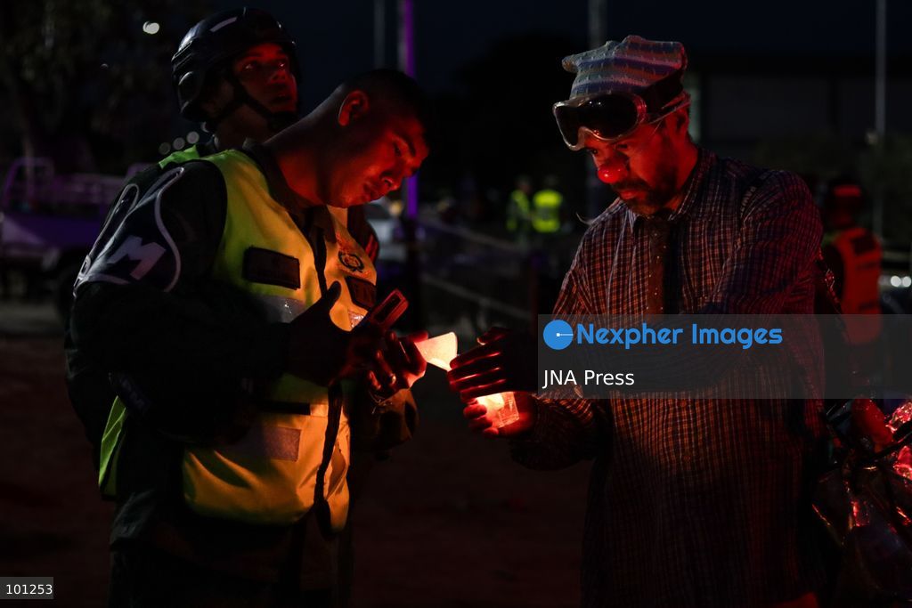 LA GUAIRA, VENEZUELA, OCTOBER 2, 2026: Families of victims, survivors and rescue workers gather during the "Haz de Luz" vigil in La Guaira to commemorate 100 days since the devastating earthquakes of June 24. Participants lit candles and joined prayers in memory of those killed and missing, while beams of light were projected into the sky near areas heavily damaged by the disaster. The commemorative event brought together residents, volunteers and emergency workers as recovery and search efforts continue in parts of La Guaira. Photo by Mario Flores/ JNA Press. (Photo by Mario Flores/JNA Press via Nexpher Images)