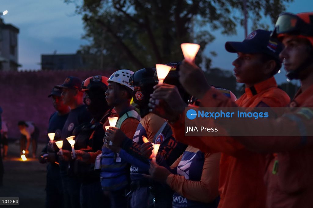 LA GUAIRA, VENEZUELA, OCTOBER 2, 2026: Families of victims, survivors and rescue workers gather during the "Haz de Luz" vigil in La Guaira to commemorate 100 days since the devastating earthquakes of June 24. Participants lit candles and joined prayers in memory of those killed and missing, while beams of light were projected into the sky near areas heavily damaged by the disaster. The commemorative event brought together residents, volunteers and emergency workers as recovery and search efforts continue in parts of La Guaira. Photo by Mario Flores/ JNA Press. (Photo by Mario Flores/JNA Press via Nexpher Images)