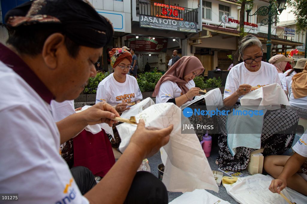 YOGYAKARTA, INDONESIA, OCTOBER 3, 2026: A total of 1,001 batik artists create traditional designs on fabric using canting tools along Malioboro Street in Yogyakarta during the "Symphony of 1001 Batik Artists" event. The mass batik-making activity was held as part of celebrations marking the 270th anniversary of Yogyakarta City and Indonesia's National Batik Day 2026. Photo by Topen Sapurta / JNA Press. (Photo by Topen Anggara Saputra/JNA Press via Nexpher Images)