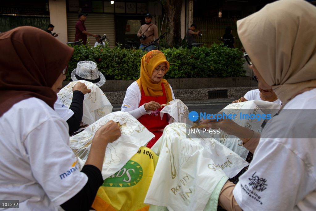 YOGYAKARTA, INDONESIA, OCTOBER 3, 2026: A total of 1,001 batik artists create traditional designs on fabric using canting tools along Malioboro Street in Yogyakarta during the "Symphony of 1001 Batik Artists" event. The mass batik-making activity was held as part of celebrations marking the 270th anniversary of Yogyakarta City and Indonesia's National Batik Day 2026. Photo by Topen Sapurta / JNA Press. (Photo by Topen Anggara Saputra/JNA Press via Nexpher Images)