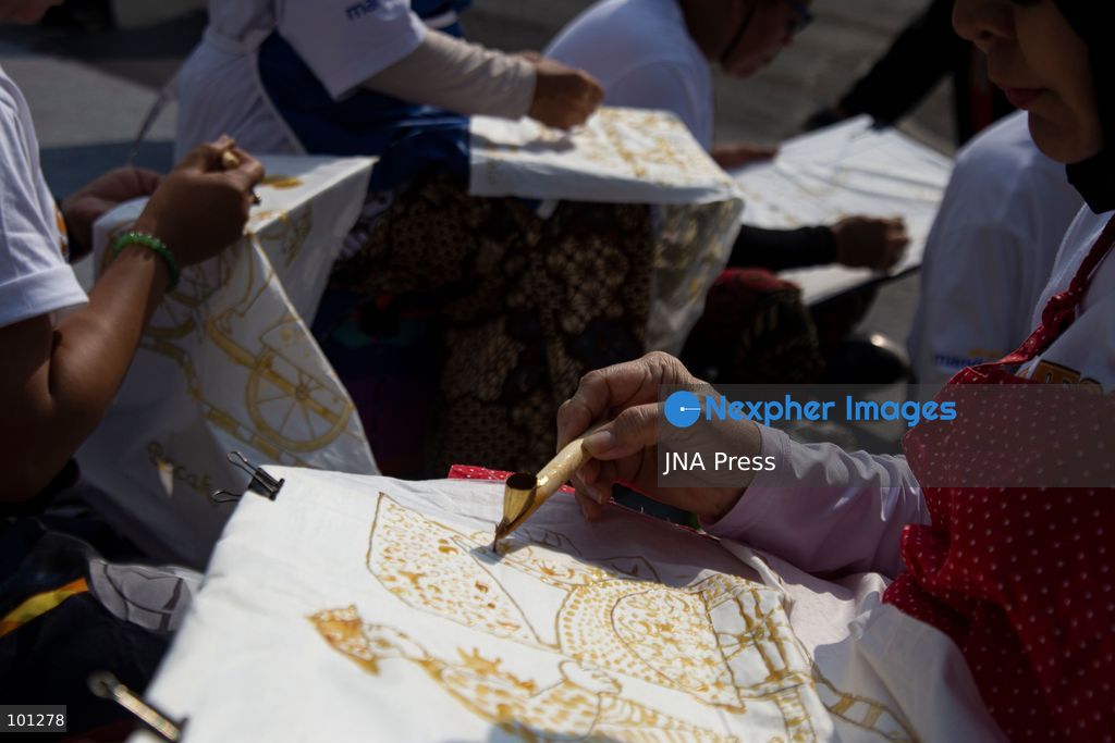 YOGYAKARTA, INDONESIA, OCTOBER 3, 2026: A total of 1,001 batik artists create traditional designs on fabric using canting tools along Malioboro Street in Yogyakarta during the "Symphony of 1001 Batik Artists" event. The mass batik-making activity was held as part of celebrations marking the 270th anniversary of Yogyakarta City and Indonesia's National Batik Day 2026. Photo by Topen Sapurta / JNA Press. (Photo by Topen Anggara Saputra/JNA Press via Nexpher Images)