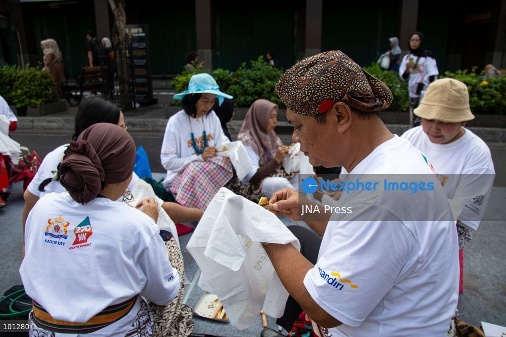 YOGYAKARTA, INDONESIA, OCTOBER 3, 2026: A total of 1,001 batik artists create traditional designs on fabric using canting tools along Malioboro Street in Yogyakarta during the "Symphony of 1001 Batik Artists" event. The mass batik-making activity was held as part of celebrations marking the 270th anniversary of Yogyakarta City and Indonesia's National Batik Day 2026. Photo by Topen Sapurta / JNA Press. (Photo by Topen Anggara Saputra/JNA Press via Nexpher Images)