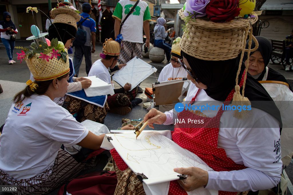 YOGYAKARTA, INDONESIA, OCTOBER 3, 2026: A total of 1,001 batik artists create traditional designs on fabric using canting tools along Malioboro Street in Yogyakarta during the "Symphony of 1001 Batik Artists" event. The mass batik-making activity was held as part of celebrations marking the 270th anniversary of Yogyakarta City and Indonesia's National Batik Day 2026. Photo by Topen Sapurta / JNA Press. (Photo by Topen Anggara Saputra/JNA Press via Nexpher Images)